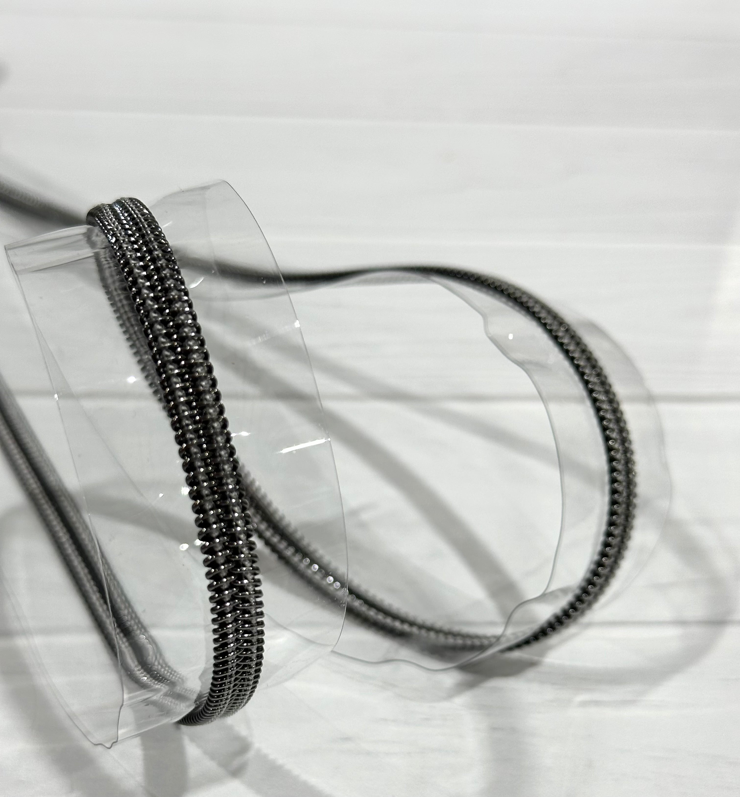 Clear vinyl zipper tape with gunmetal teeth