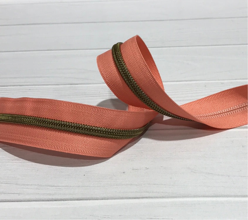 Peach with antique teeth zipper tape