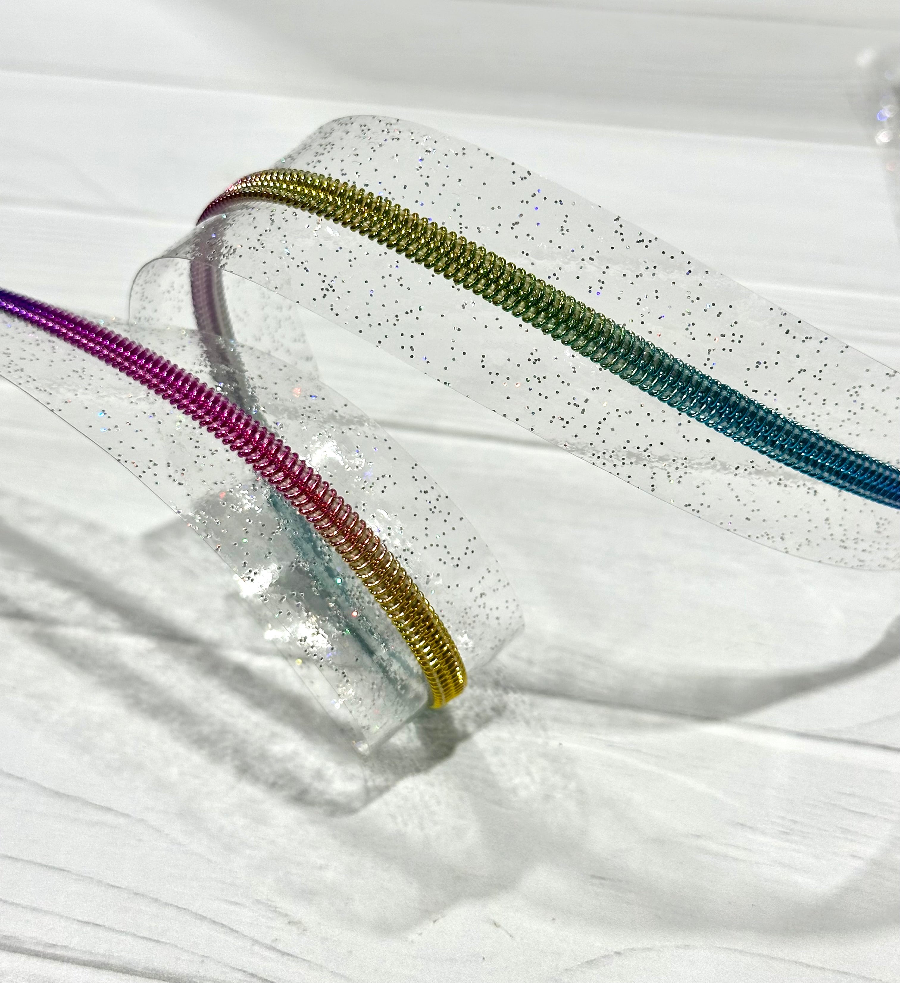 Clear holographic sparkle vinyl zipper tape with rainbow teeth