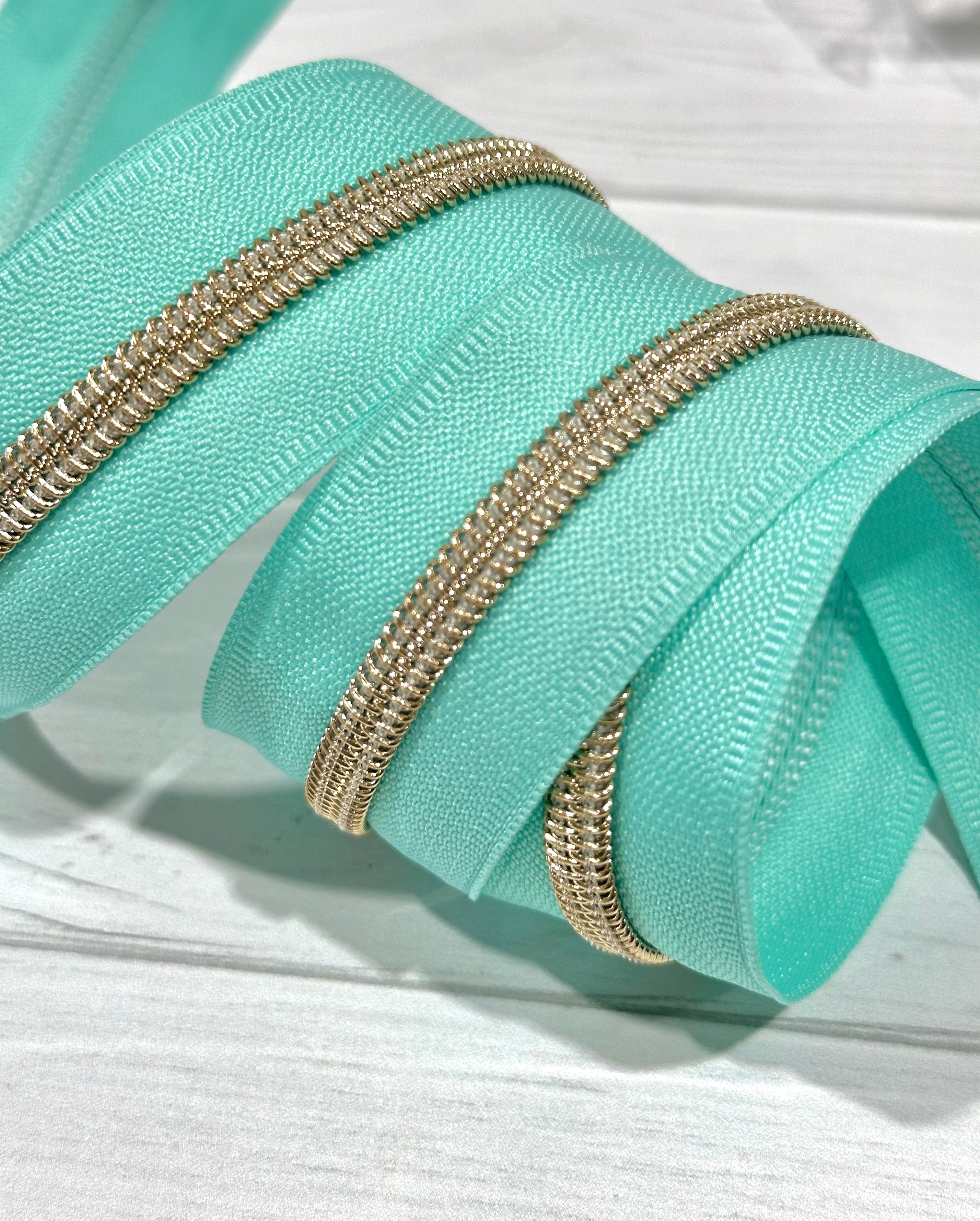 Mint Tape with Gold Teeth Zipper Tap