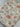 Patterned fabric with cartoon ghosts wearing glasses and books on a beige background