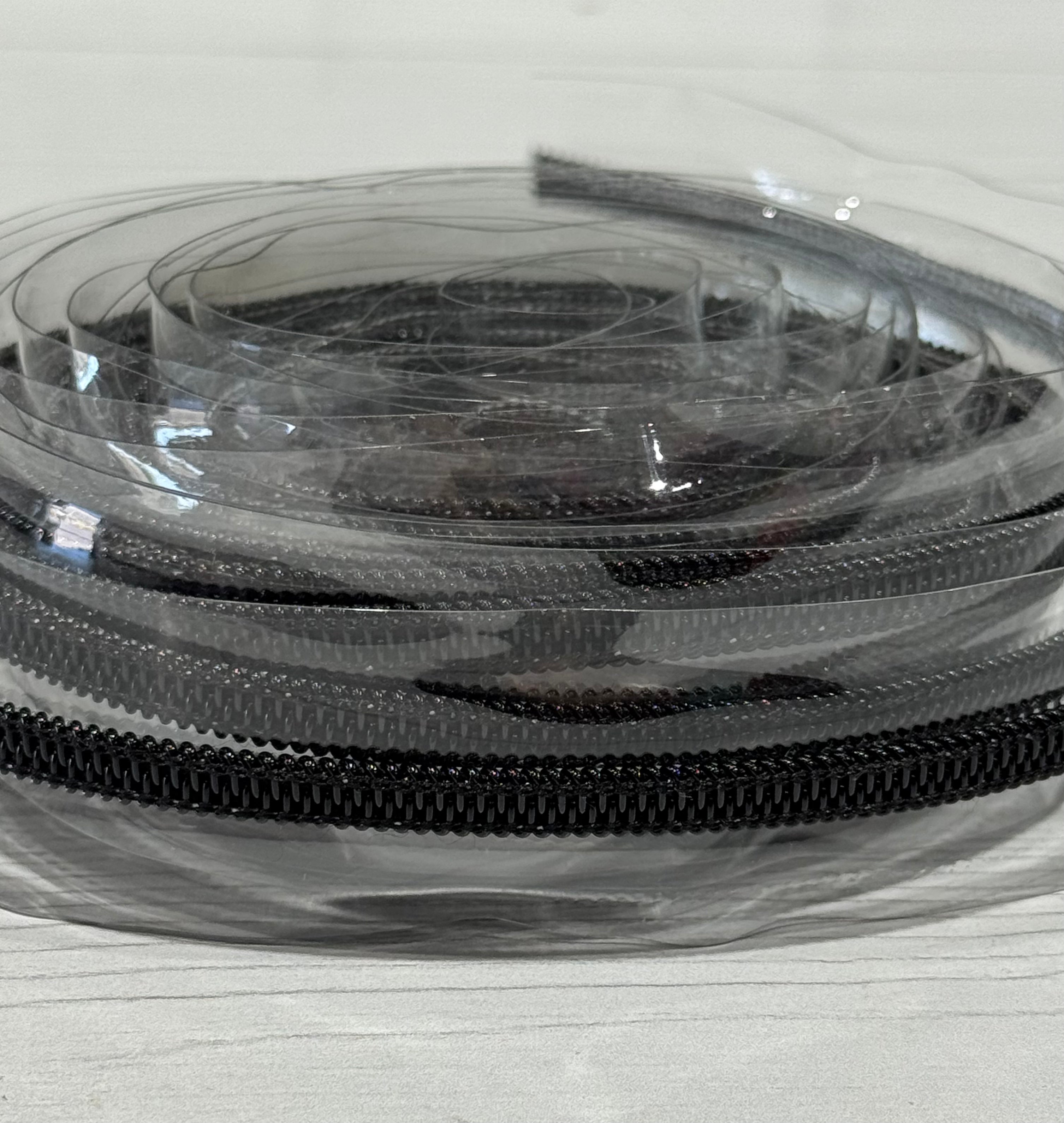 Clear zipper tape with Black teeth