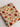 Fabric with autumn-themed pattern featuring mushrooms and flowers on a white background