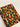 Notebook with a colorful mushroom and flower pattern on a black background