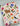 Fabric with cat and floral pattern on a wooden surface