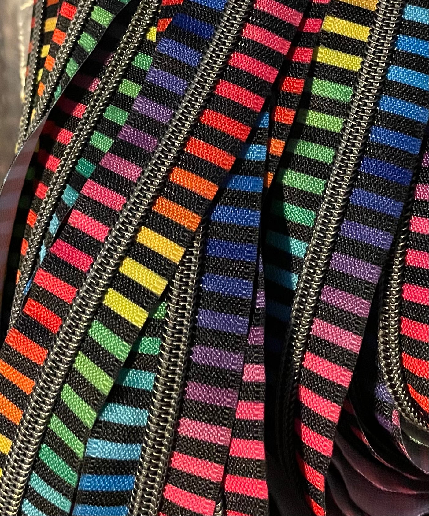 Horizontal Rainbow stripe with gun metal teeth zipper tape