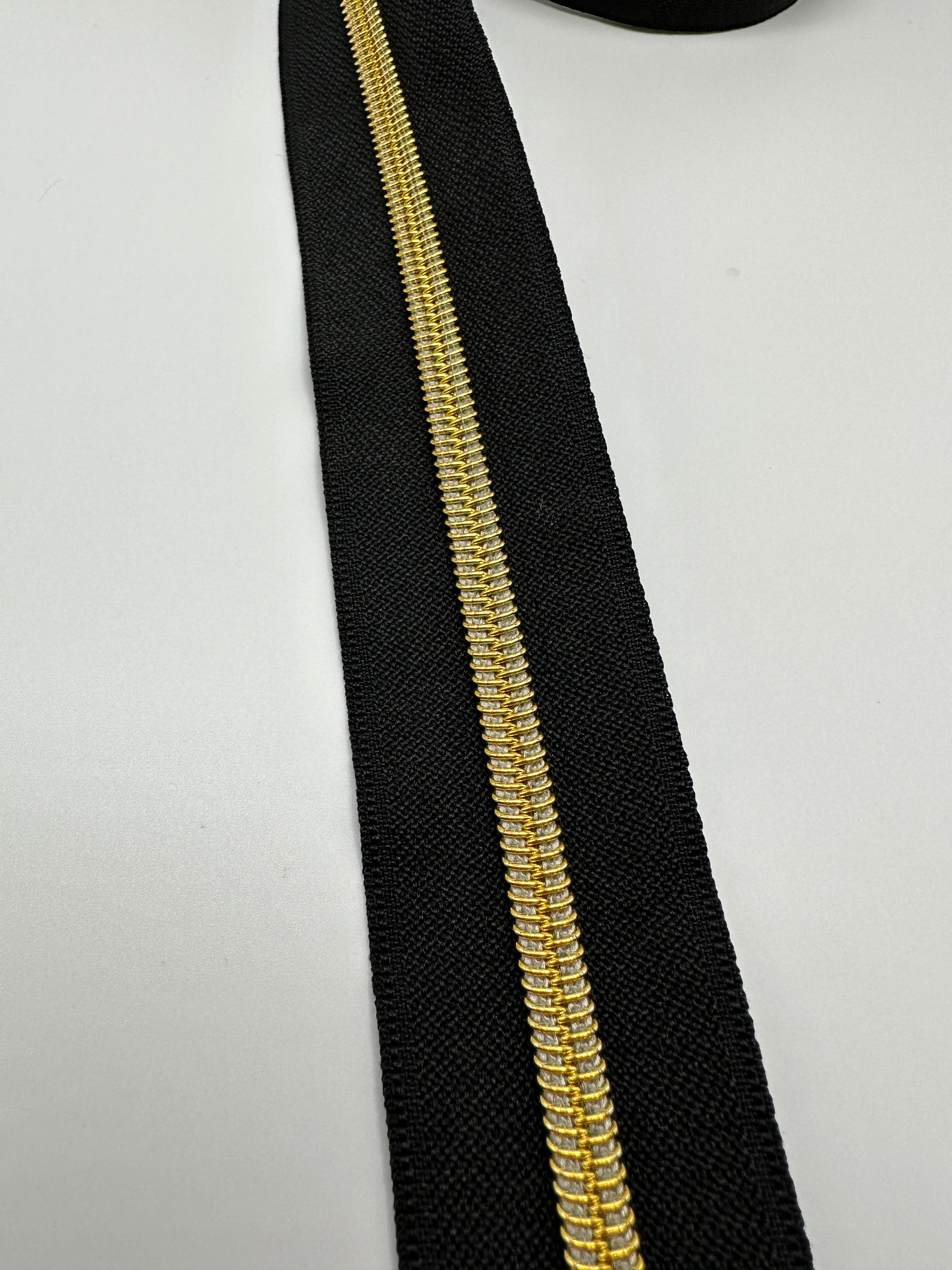 Gold teeth on Black zipper tape